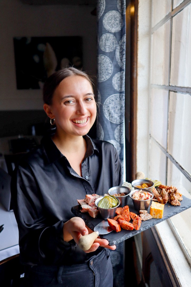server holding food server holding food at Southern Food Restaurant in Madison